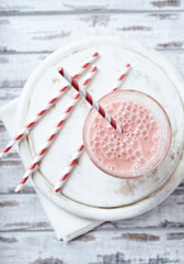 Strawberry Smoothie on bright wooden background. Top view.	