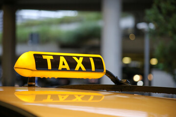 Taxi sign on cab, close-up view