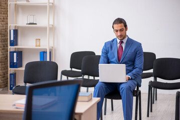 Young businessman making presentation during pandemic