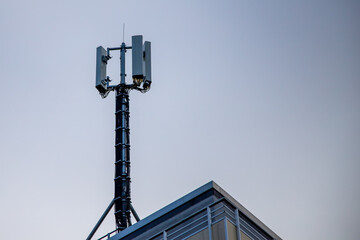 Fototapeta na wymiar telecommunication antenna on a rooftop