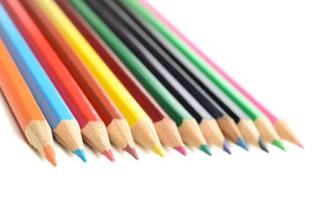A set of colored pencils on white background