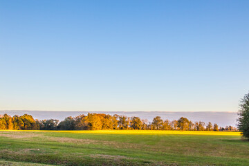 Fototapeta premium View of open country land and clouds on the horizon