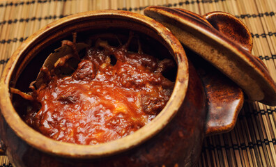 Homemade dishes cooked in the oven, in clay pots