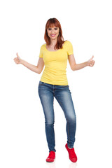 Obraz premium Confident Young Woman Is Showing Thumbs Up
