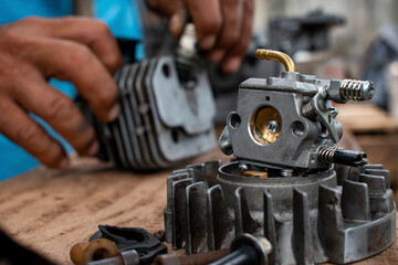 carburetor and engine parts under repair