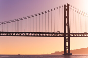 Ponte 25 de Abril Lisboa Lisbon Portugal bridge and Sanctuary of Christ the King, Santuário de Cristo Rei in the morning sunrise over Tagus river