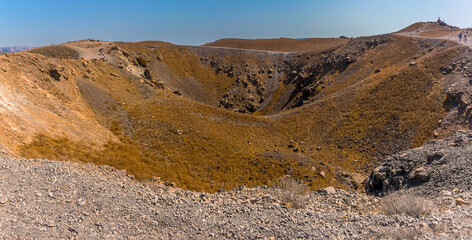 A panorama view across a crater on the volcanic island of Nea Kameni, Santorini in summertime © Nicola