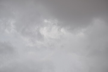 Blue sky with puffy white clouds.