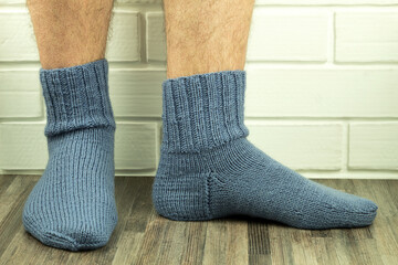 Handmade socks, warm and do-it-yourself knitted socks close-up