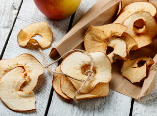 dried apple slices on an old table