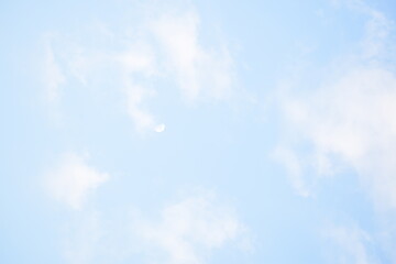 Blue sky with puffy white clouds.