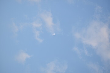 Blue sky with puffy white clouds.