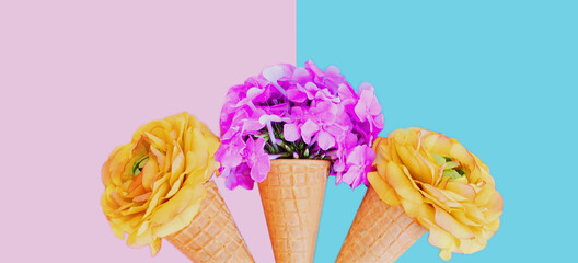 Cone with pink flowers as ice cream over a blue background