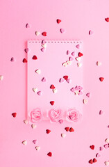 Valentines Day. Heart shape formed of sweet confetti on pink background. Template mock up of greeting card or text design. Close-up