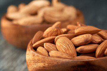 Almond kernels lie on a dark background.Selective focus.Salted almonds.