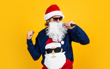 Fototapeta na wymiar cheerful santa man hipster sing christmas music songs. preparation and celebration. funny party time. happy winter holidays. new year mood. christmas shopping. sales and discounts. buy xmas gifts