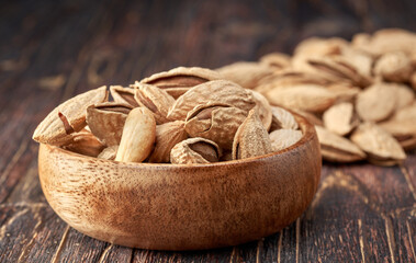 Almond kernels lie on a dark background.Selective focus.Salted almonds.