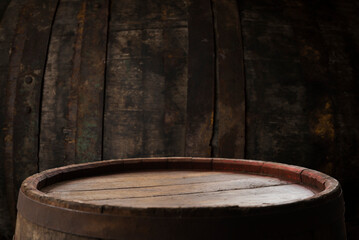 Old wooden barrel on a brown background