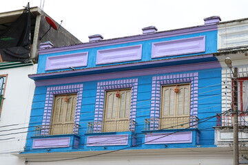 Colorful facades of Colombian towns in blue and purple