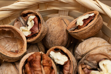 Close up of walnuts in a basket. Opened and not disclosed