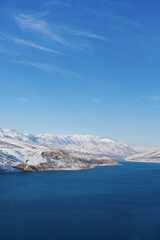 Fototapeta na wymiar amazing winter landscape of Charvak reservoir in winter Uzbekistan