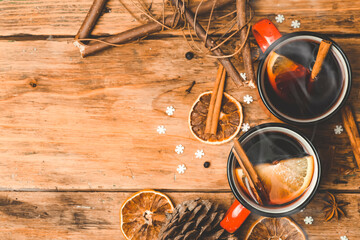 Mulled wine background. A hot winter Christmas drink based on red wine, spices and citrus fruits.