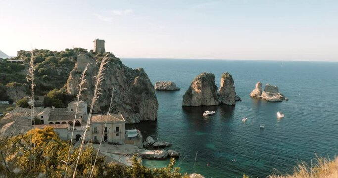Panorama of a the creek of Faraglioni di Scopello in Sicilia, beautiful sunset
