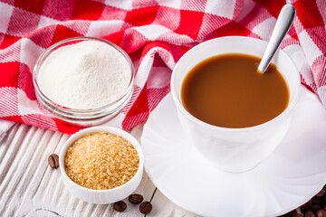 cup of fragrant fresh coffee on a white wooden rustic background