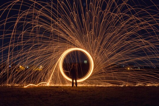 Person Spinning Wire Wool At Night