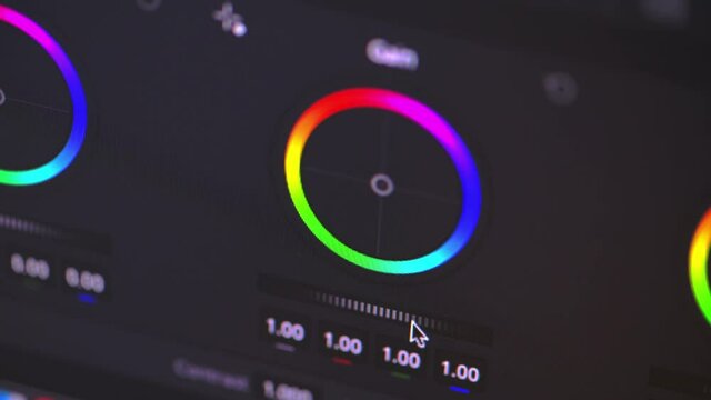 Detail of PC monitor with video editing color gradient. The mouse moves over a control cursor