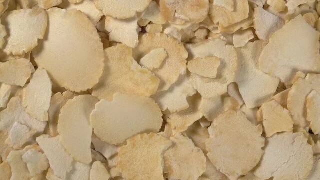Rotation of pea flakes close-up. Fast-cooked pea porridge.