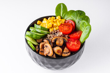 bowl of healthy quinoa with vegetables on a white background