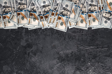 A bundle of money on a dark background. Business concept