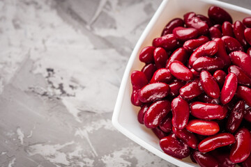 canned red kidney beans on a dark stone rustic background