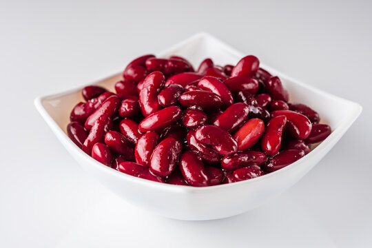 canned red kidney beans on a white acrylic background
