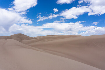 Fototapeta na wymiar Dramatic sand dunes in Colorado blue sky