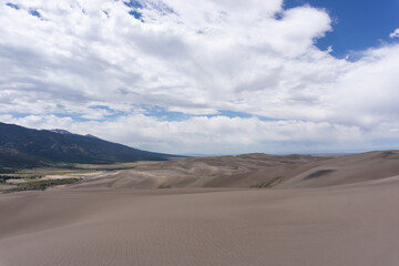 Fototapeta na wymiar Mountains behind sand dunes in Colorado
