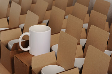 
white mugs in craft cardboard boxes