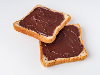 toasts with chocolate butter on a white acrylic background