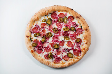 Italian pizza with jalapenos, sausage, cheese and onions top view. Italian fast food delivery.