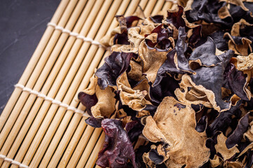 delicious asian black fungus mushroom on a dark stone background