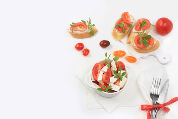 Caprese Bruschetta toast with mozzarella cheese, cherry tomatoes and fresh garden Basil.Traditional Italian food, healthy natural Breakfast, cholesterol-free and GMO-free, space for text,