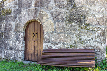 seat at the entrance of a chapel