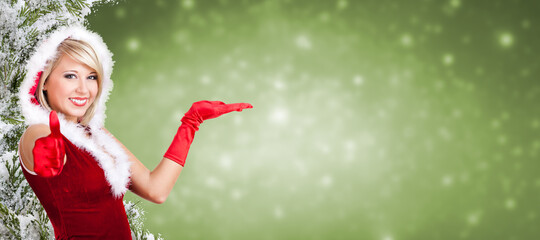 smiling woman dressed as Miss Santa in front of christmas background