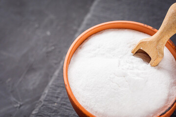 baking soda powder on a dark stone background