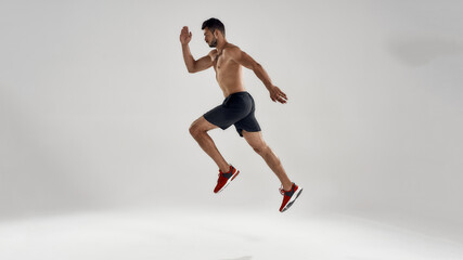 Fototapeta na wymiar Young handsome caucasian professional male runner jumping