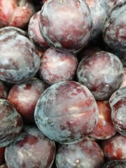 plums on market stall