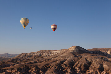Fototapeta na wymiar Balloons in the sky of Cappadocia, Turkey. 
