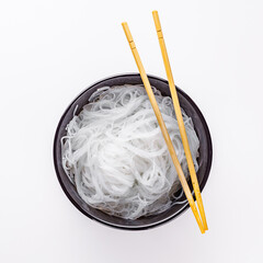 boiled glass noodles on a white acrylic background