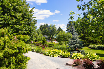 Fototapeta na wymiar Lovely Garden at Rouyn ( Quebec ) With Footpath